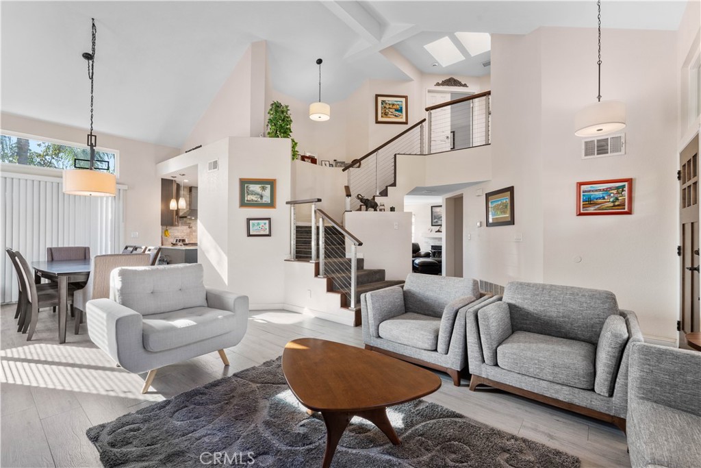10963 San Mateo Place Rancho Cucamonga, CA 91701 - Photo 9 of 37 a living room with furniture and a chandelier