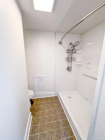 a bathroom with a bathtub and shower