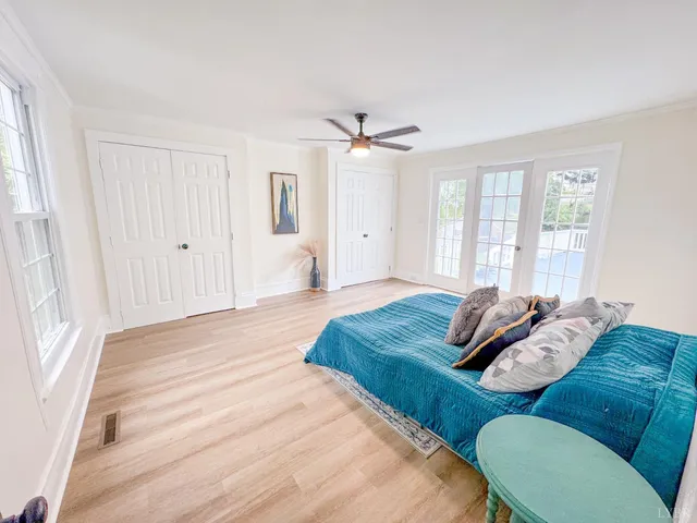 a living room with furniture and a bed