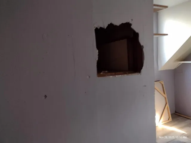 a view of room with wooden floor