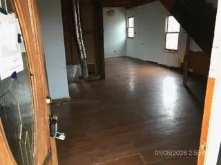 a kitchen with granite countertop a refrigerator stove and sink