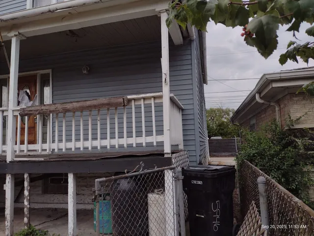 a balcony with table and chairs