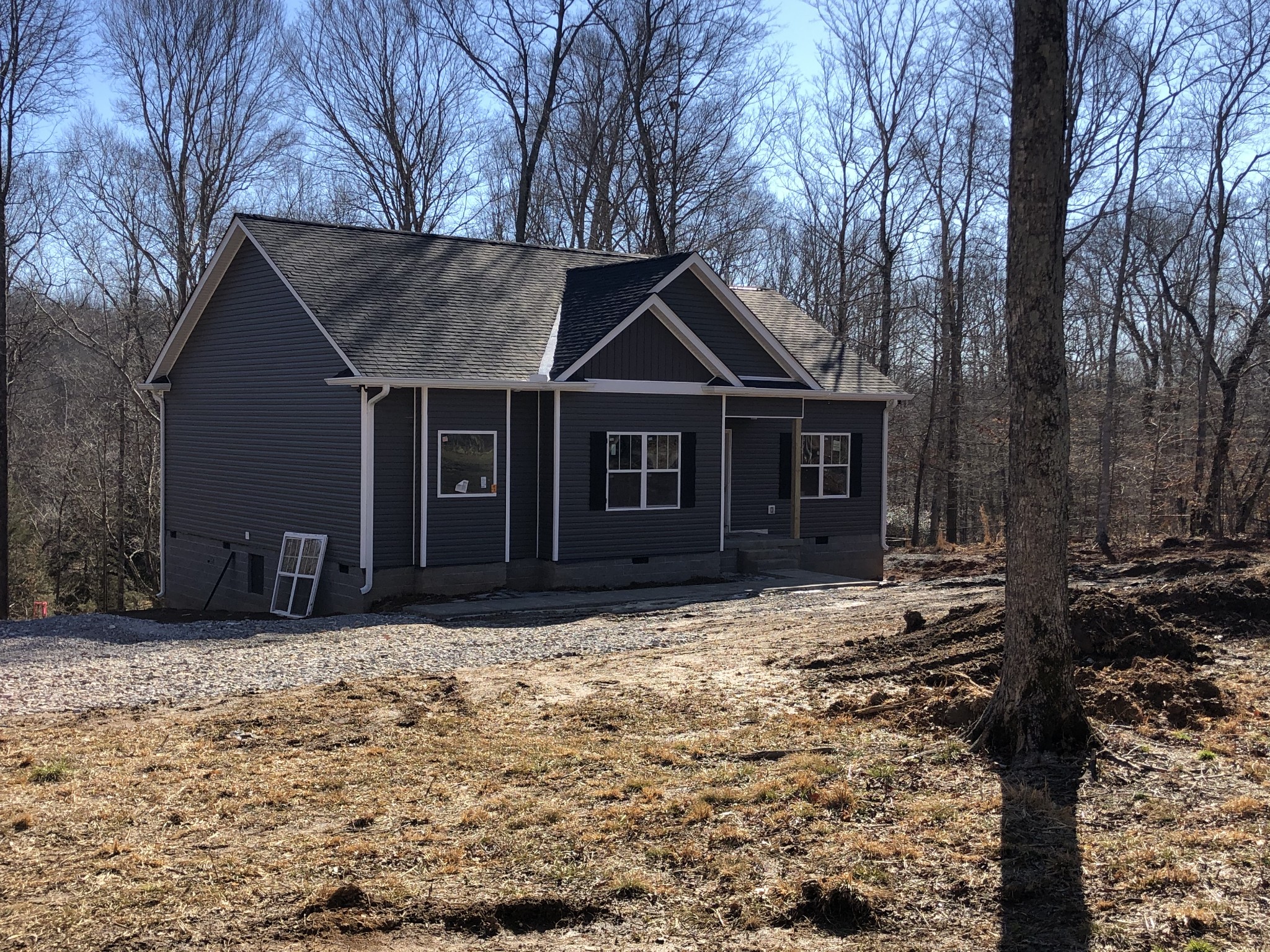 276 A Murrell Road Dickson, TN 37055 - Photo 1 of 8 a front view of a house with a yard