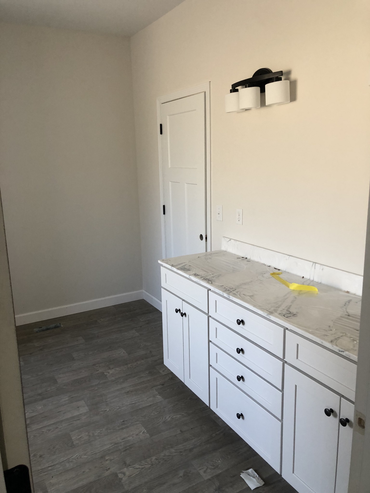 276 A Murrell Road Dickson, TN 37055 - Photo 7 of 8 a bathroom with a granite countertop sink and white cabinets