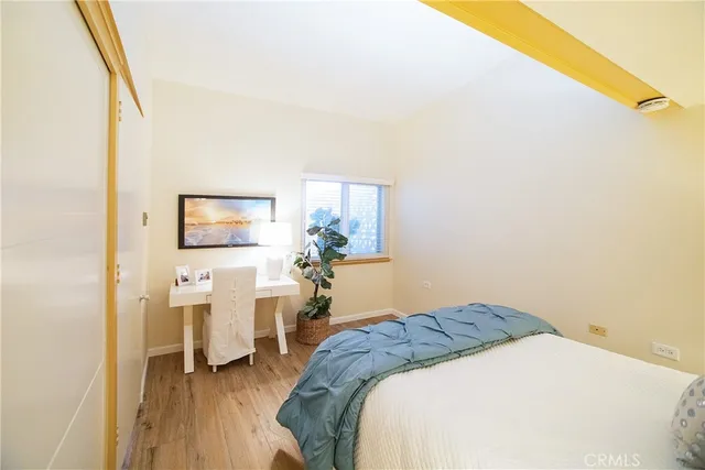 a view of a livingroom with an empty space and wooden floor