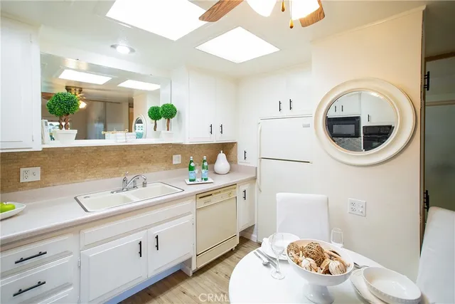 a utility room with sink dryer and washer