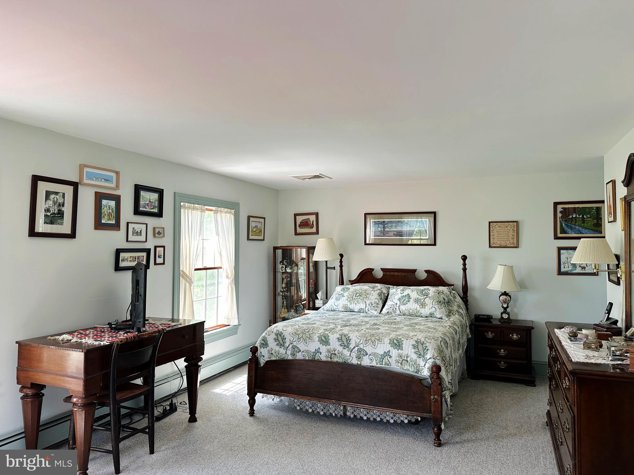 2382 Bergey Road Harleysville, PA 19438 - Photo 36 of 52 a bedroom with a bed and a table in it