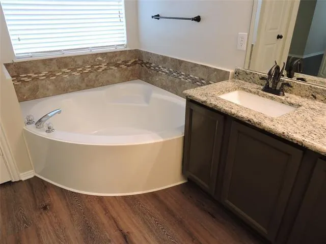 a view of a bathtub in a bathroom