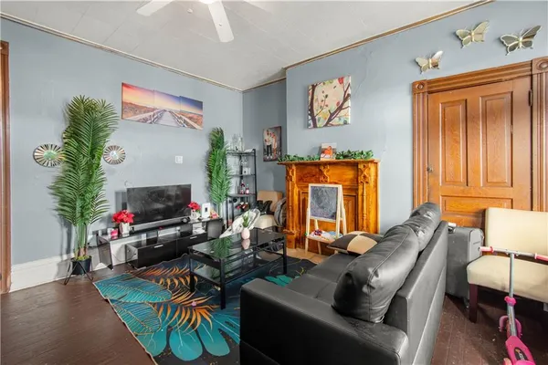 a bedroom with a bed couch and dresser