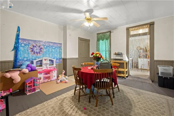 a dining room with furniture and window