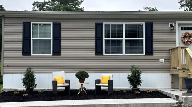 a view of house with outdoor space and porch