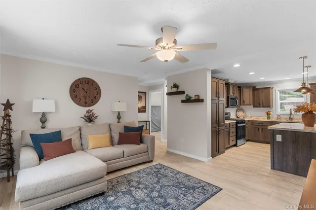 a living room with furniture a clock on wall and a clock