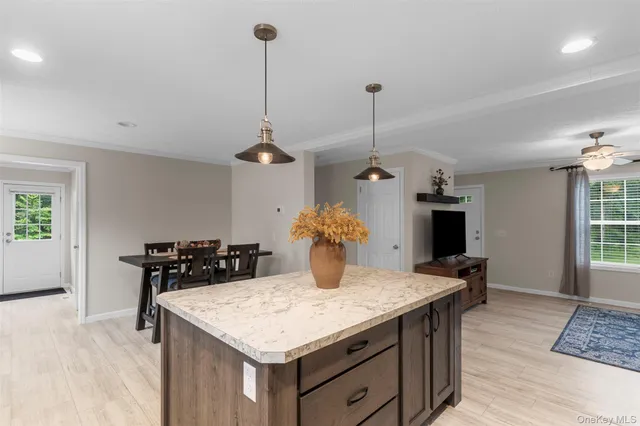 a kitchen with a counter space dining table and chairs
