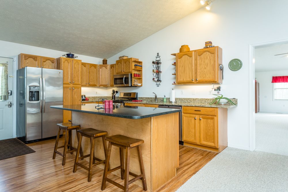 4729 Conicville Road Mount Jackson, VA 22842 - Photo 3 of 36 a kitchen with stainless steel appliances granite countertop a sink and cabinets