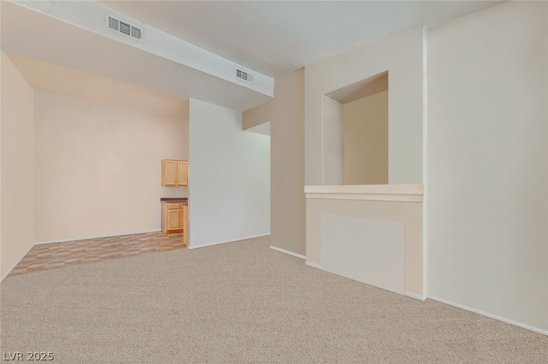 2305 West Horizon Ridge Parkway, Unit 1223 Henderson, NV 89052 - Photo 6 of 28 Spare room with light colored carpet and baseboards