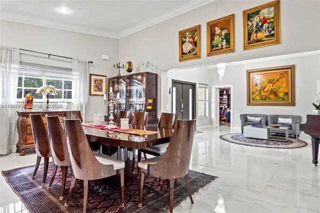 a dining room with furniture and window