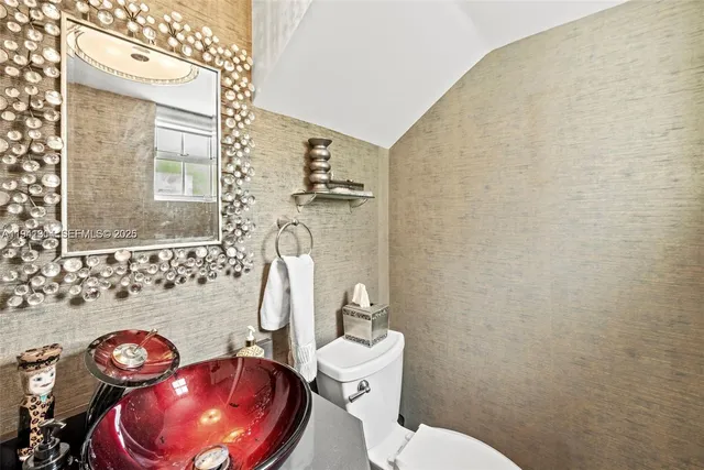 a bathroom with a toilet and a sink