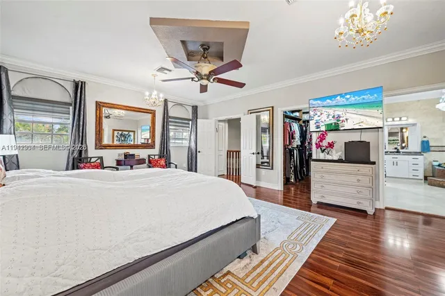 a living room with stainless steel appliances furniture and a view of kitchen