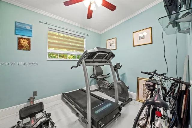 a view of a storage and utility room with washer and dryer