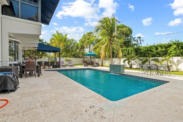 a view of a swimming pool with a lounge chairs