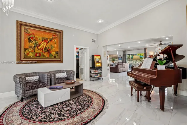 a living room with furniture and a piano