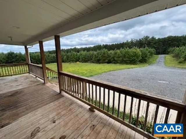 a view of a two chairs in the balcony