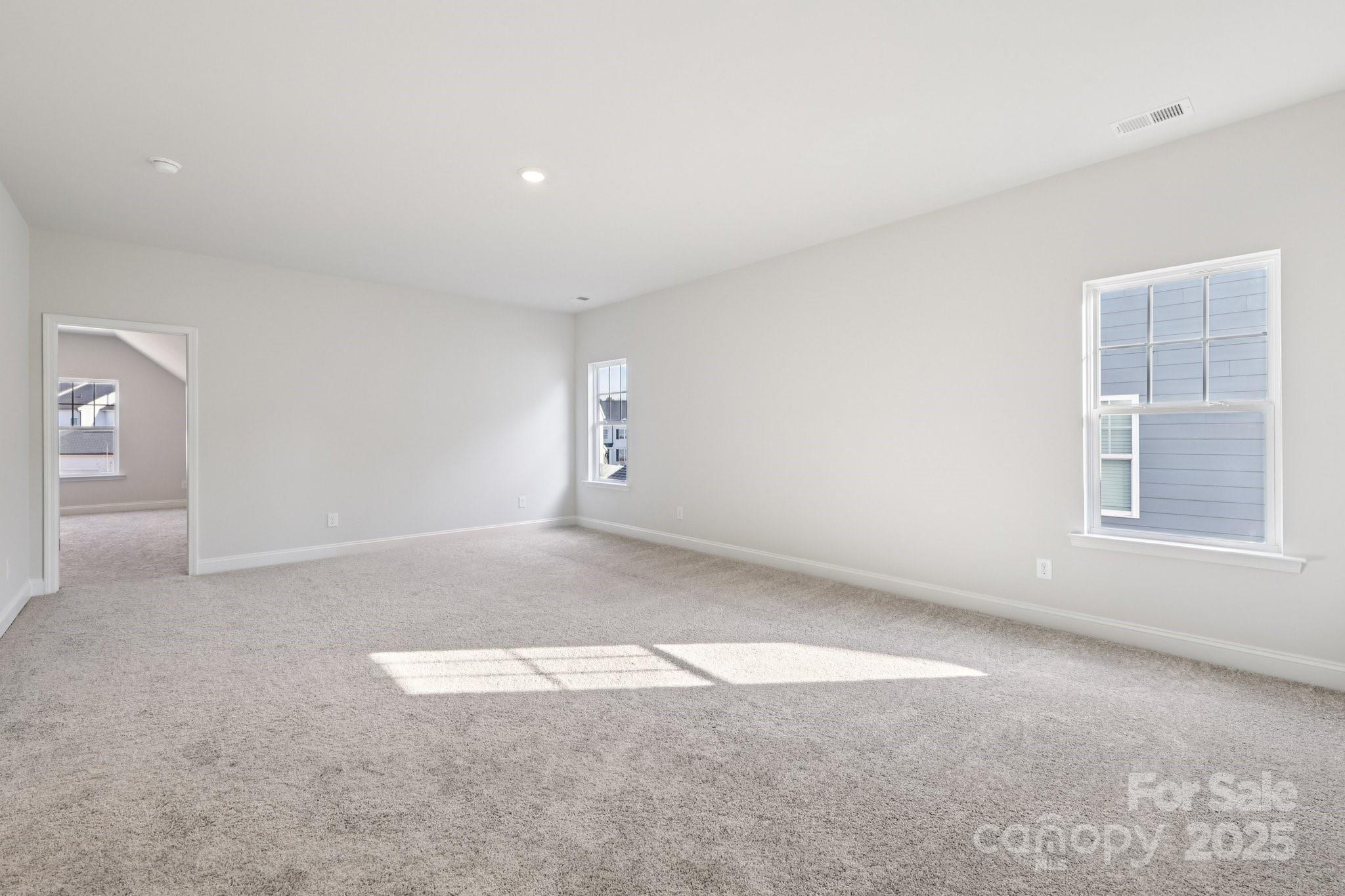 9612 Pointer Road, Unit 59 Huntersville, NC 28078 - Photo 29 of 43 an empty room with windows