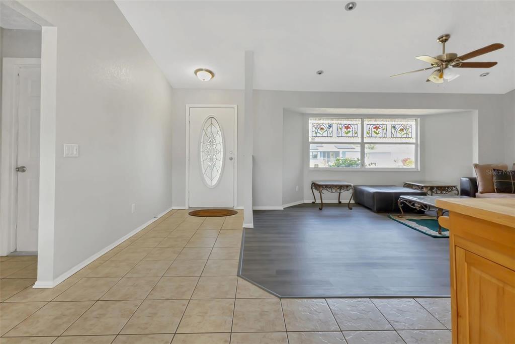 23177 Rye Avenue Punta Gorda, FL 33980 - Photo 11 of 48 a view of a livingroom with wooden floor and a ceiling fan