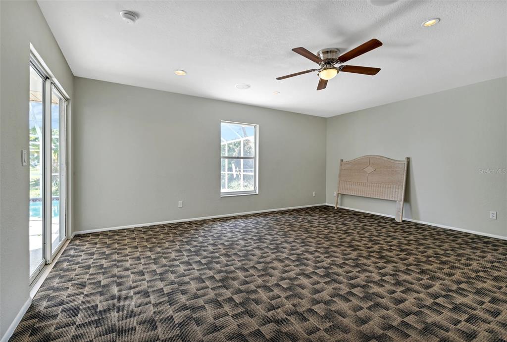 23177 Rye Avenue Punta Gorda, FL 33980 - Photo 12 of 48 a view of a livingroom with a window and ceiling fan
