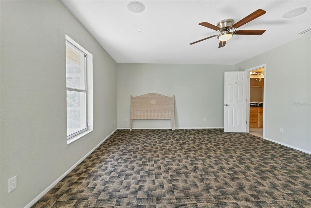 23177 Rye Avenue Punta Gorda, FL 33980 - Photo 13 of 48 a bedroom with a bed and a window