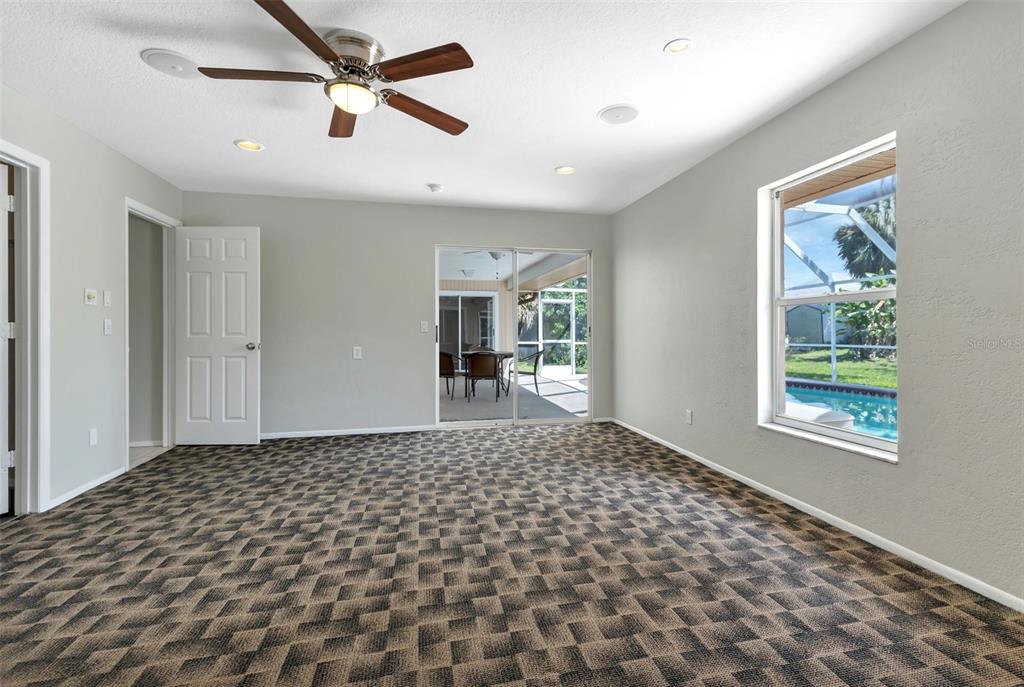23177 Rye Avenue Punta Gorda, FL 33980 - Photo 14 of 48 a bedroom with a bed and a window