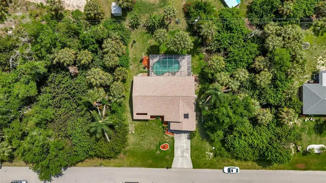 an aerial view of house with yard