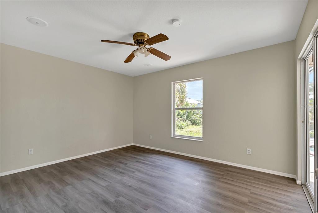 23177 Rye Avenue Punta Gorda, FL 33980 - Photo 25 of 48 a view of empty room with wooden floor and fan
