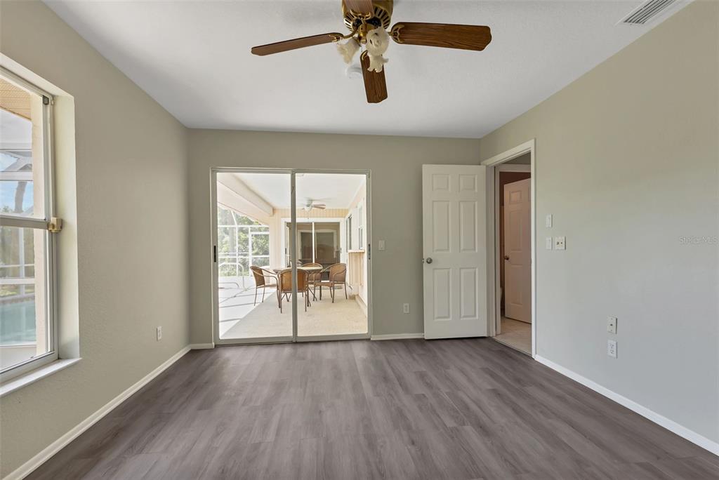23177 Rye Avenue Punta Gorda, FL 33980 - Photo 27 of 48 a view of empty room with wooden floor and fan