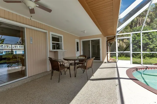 a view of a livingroom with furniture and a large window