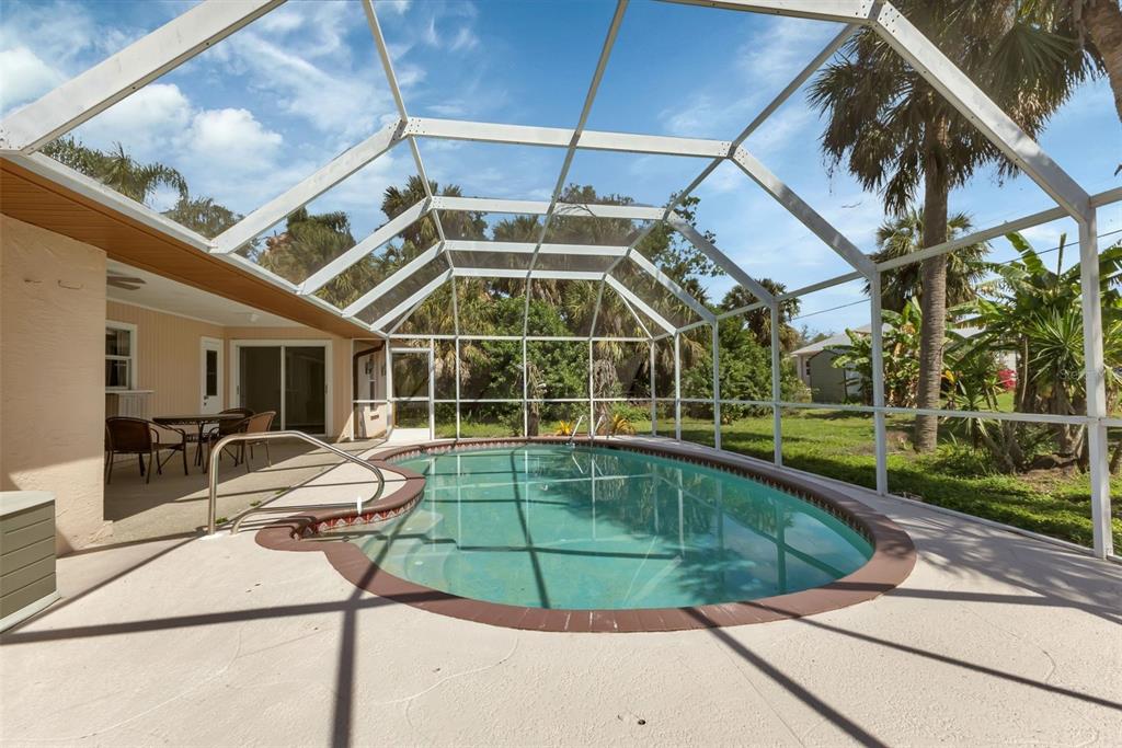 23177 Rye Avenue Punta Gorda, FL 33980 - Photo 34 of 48 a view of a swimming pool with a patio and yard of the house