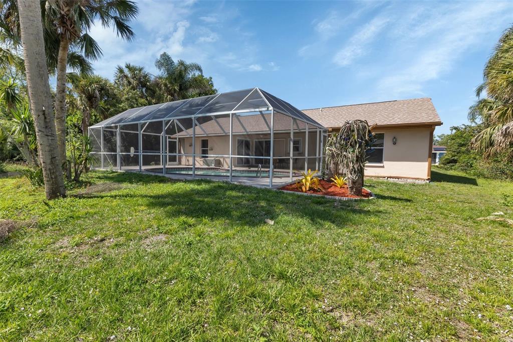 23177 Rye Avenue Punta Gorda, FL 33980 - Photo 40 of 48 a front view of a house with a yard table and chairs