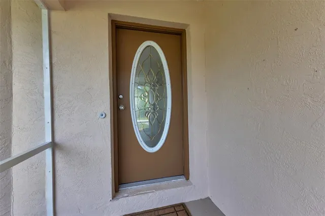 a view of a door with washer and dryer