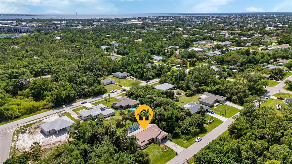 23177 Rye Avenue Punta Gorda, FL 33980 - Photo 42 of 48 an aerial view of residential houses with outdoor space and trees