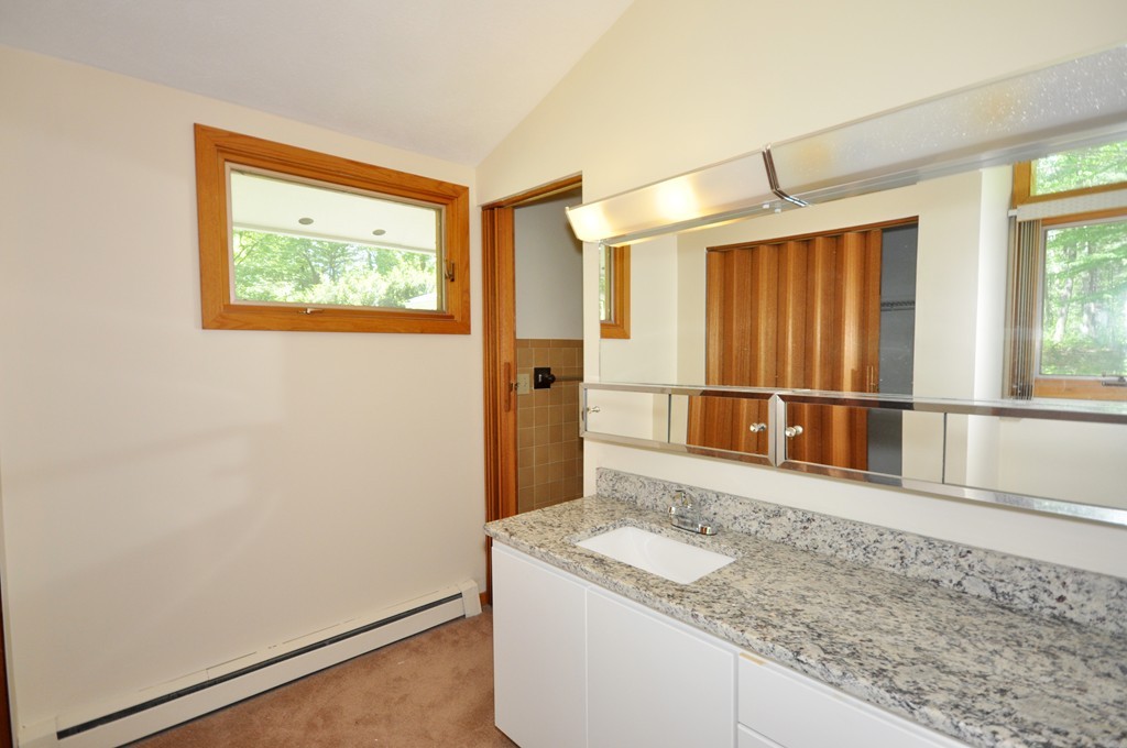 136 Temple Road Concord, MA 01742 - Photo 15 of 27 a view of a hallway with wooden floor and a window