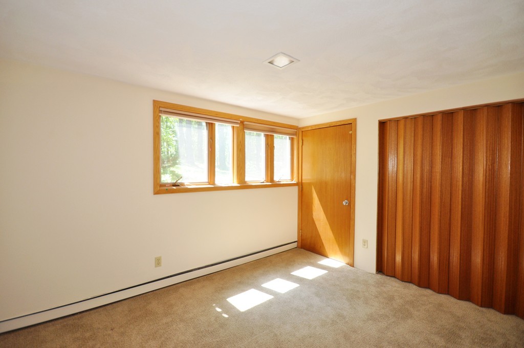136 Temple Road Concord, MA 01742 - Photo 20 of 27 a view of an empty room with a window
