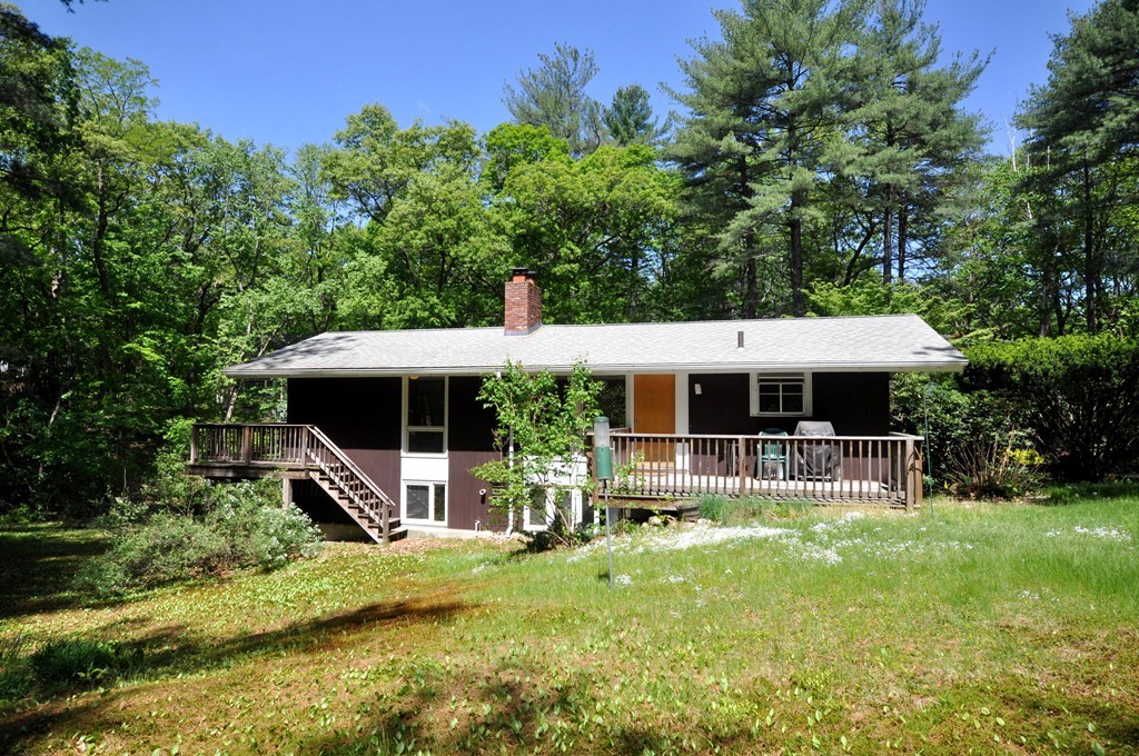 136 Temple Road Concord, MA 01742 - Photo 25 of 27 a view of a house with a yard patio and sitting area