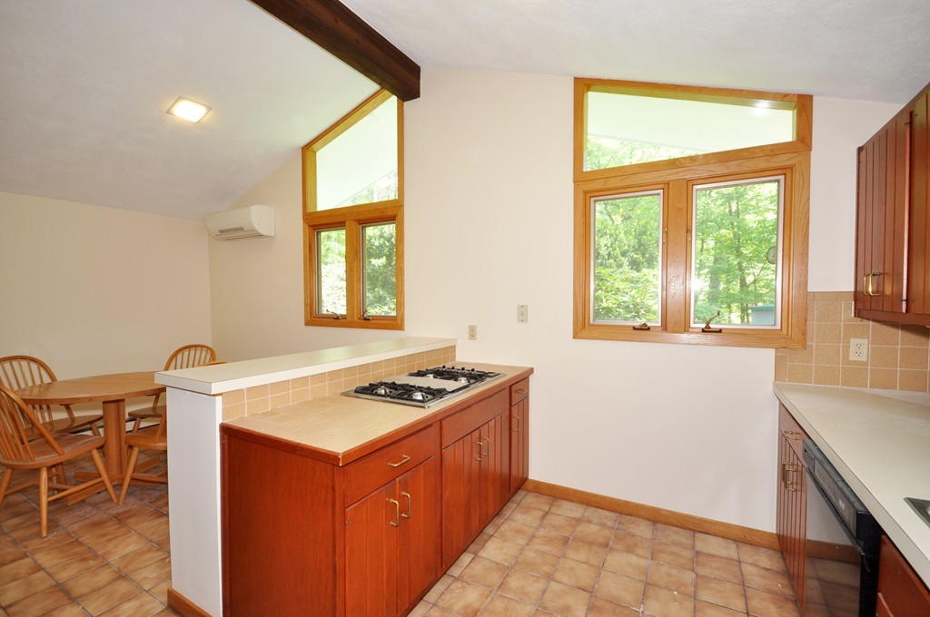 136 Temple Road Concord, MA 01742 - Photo 6 of 27 a kitchen that has a stove and a table in it