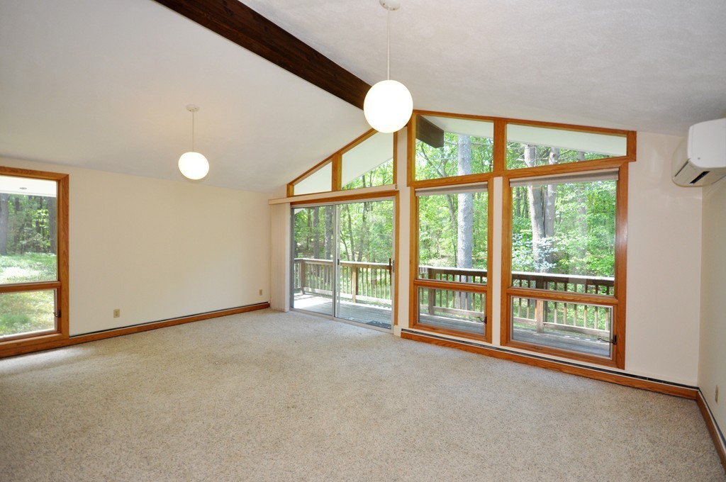 136 Temple Road Concord, MA 01742 - Photo 8 of 27 an empty room with windows and city view