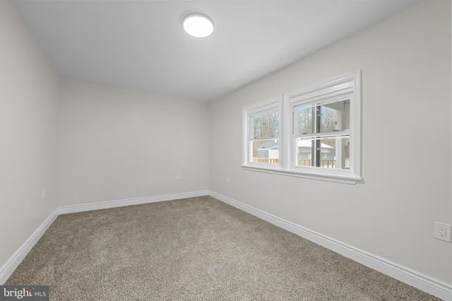 a view of street with snow on the road