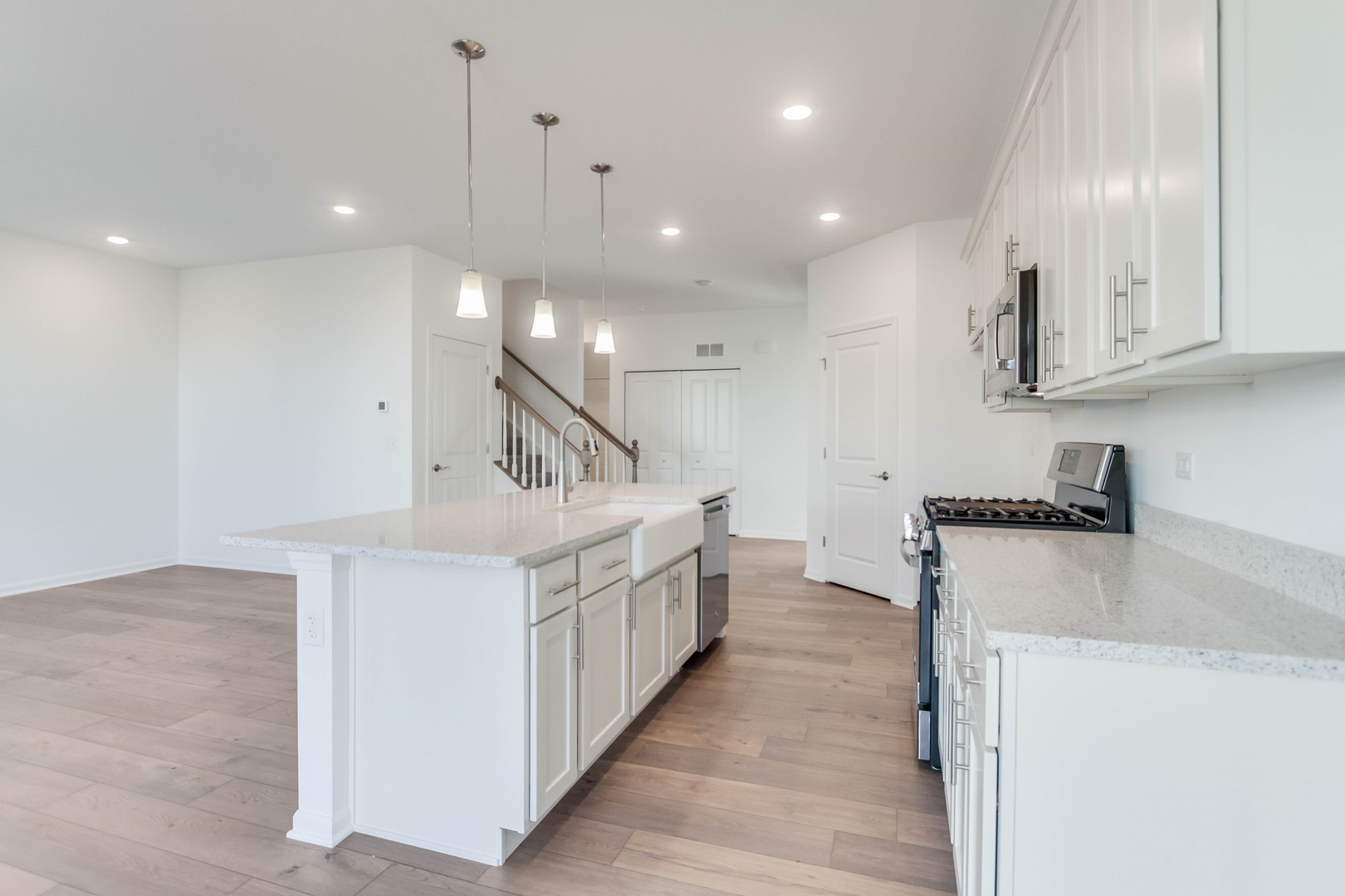25501 West Emory Lane Plainfield, IL 60544 - Photo 12 of 28 a kitchen that has a lot of cabinets in it and wooden floors
