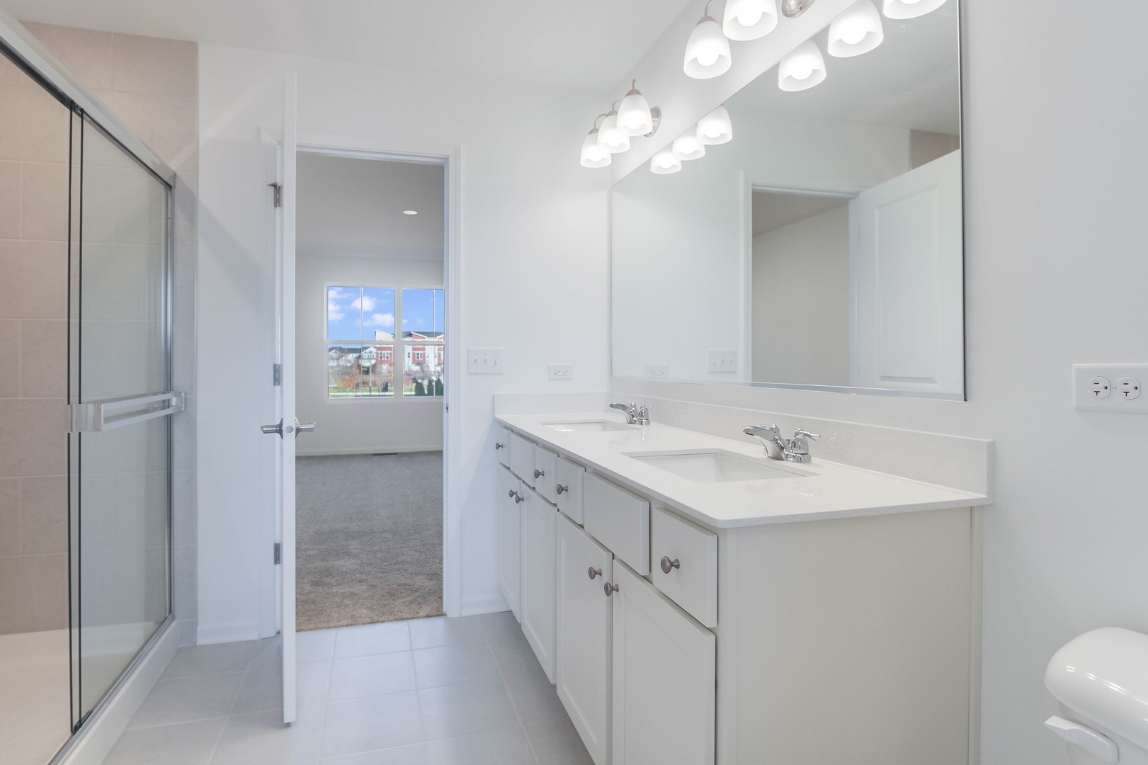 25501 West Emory Lane Plainfield, IL 60544 - Photo 20 of 28 a spacious bathroom with a double vanity sink a mirror and shower