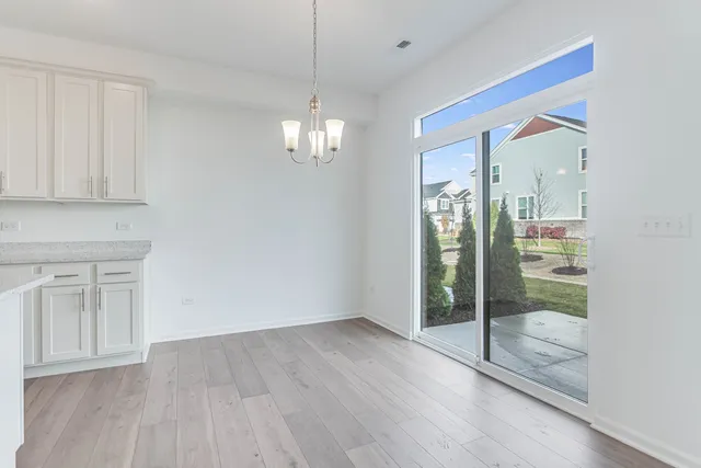 a view of a livingroom with a furniture wooden floor and window