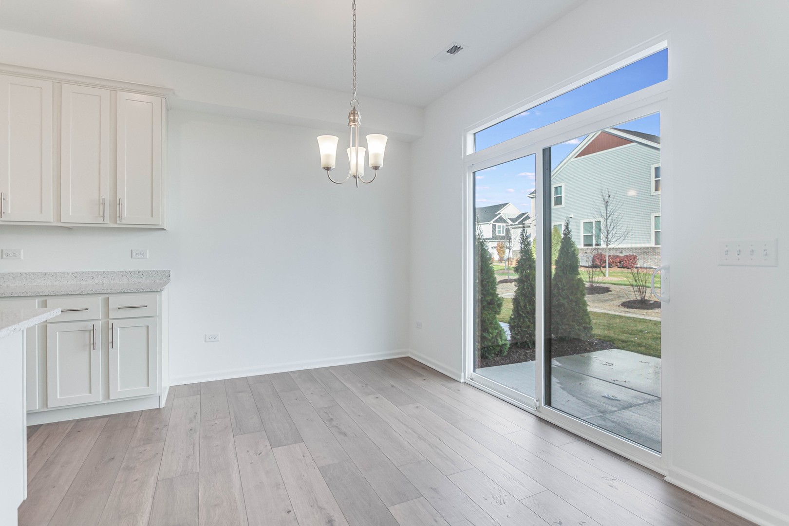 25501 West Emory Lane Plainfield, IL 60544 - Photo 9 of 28 a view of an empty room with glass door