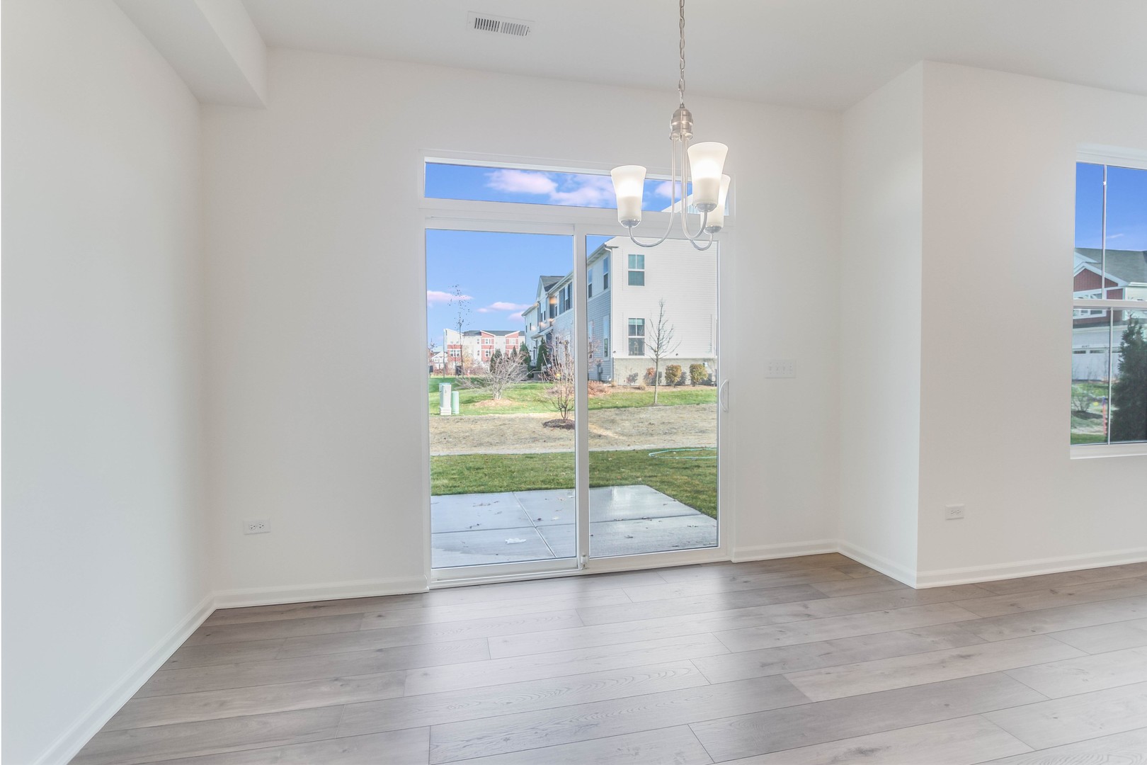 25501 West Emory Lane Plainfield, IL 60544 - Photo 10 of 28 a view of a livingroom with a furniture wooden floor and window